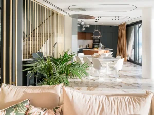 Luxurious living space blending natural tones, marble, and soft sunlight.