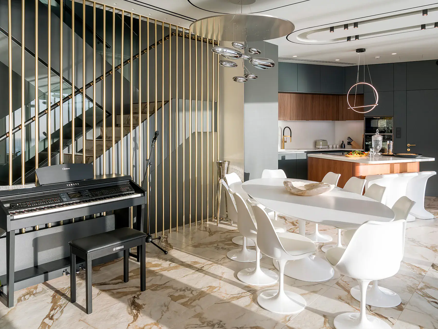 Open-plan luxury dining area inside Meltemi Villa with modern decor and sea view.